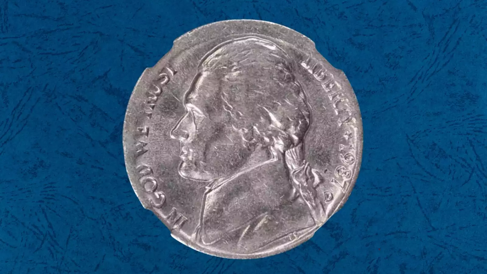 1987-P nickel struck on clad quarter stock error showing thin planchet and clad edge layers