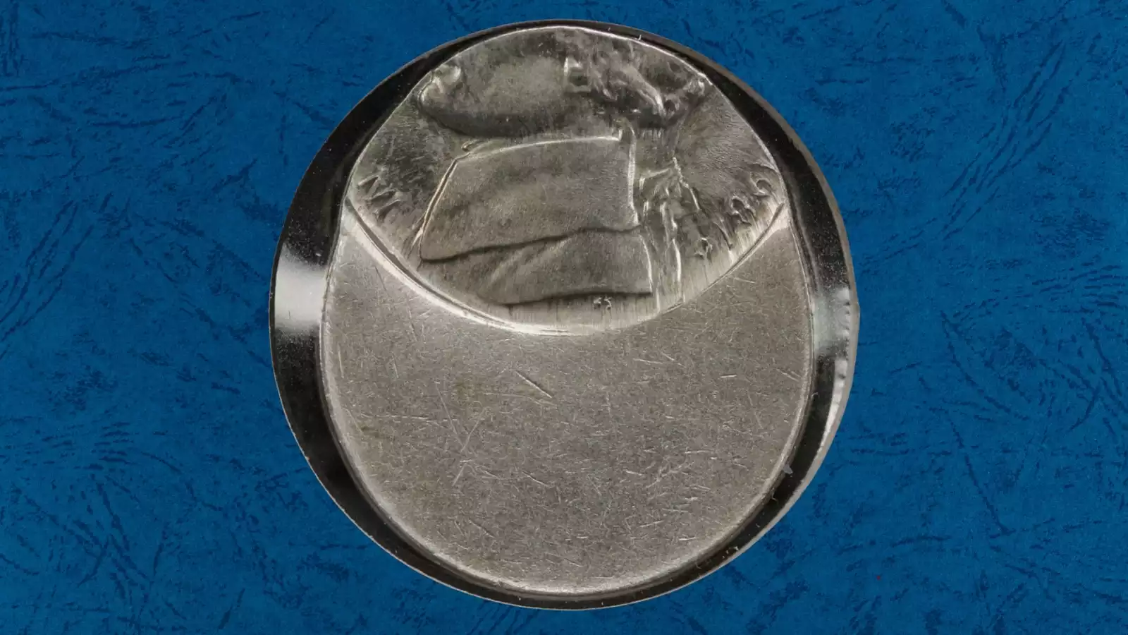 1987 Jefferson nickel off-center strike error showing blank crescent area and shifted design